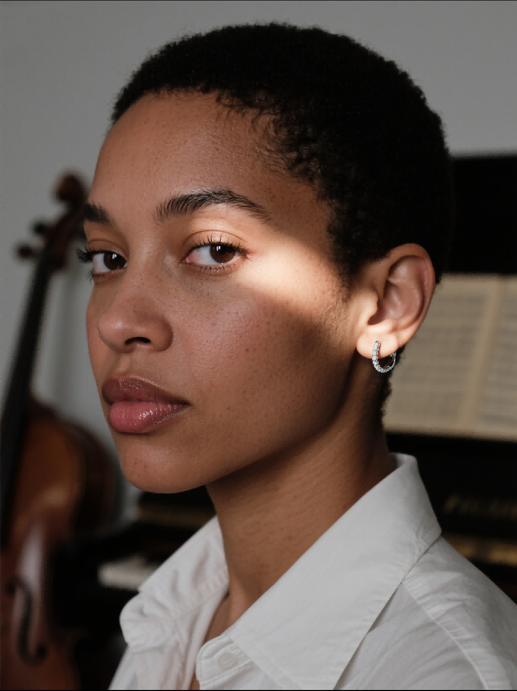 Customer wearing buzzbloom Sterling silver hoop earrings with moissanite, everyday elegant woman indoors
