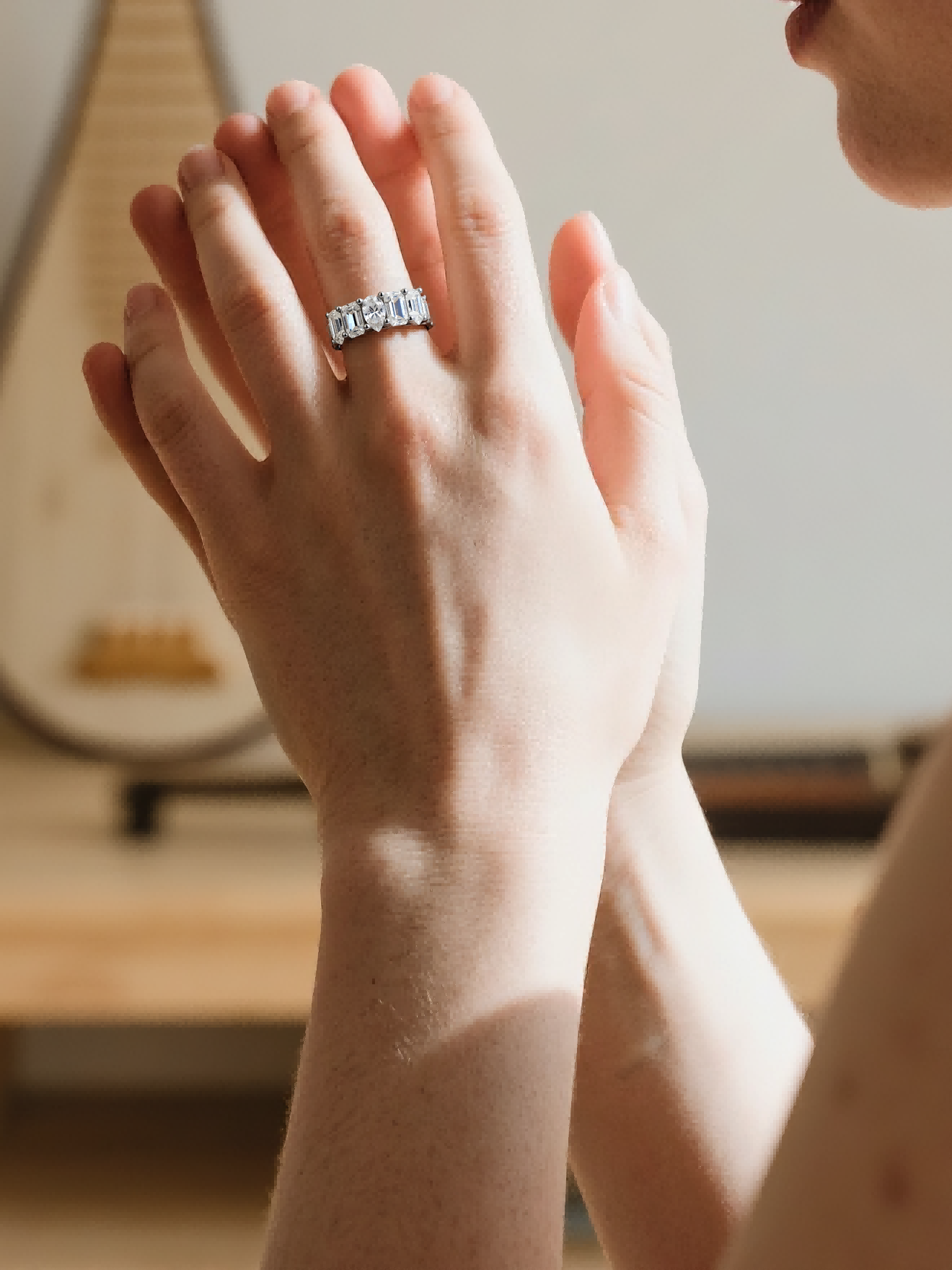 Customer wearing BuzzBloom diamond band ring outdoors near camper, elegant woman lifestyle jewelry