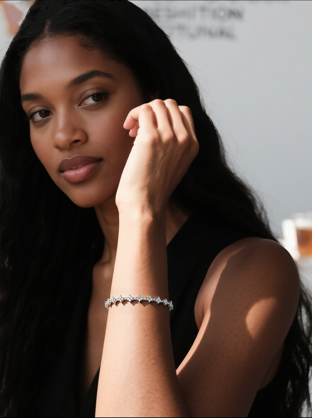 Customer wearing BuzzBloom luxury diamond tennis bracelet, side view in natural light, women’s bridal jewelry scene