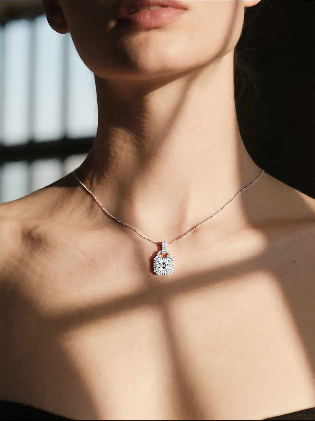 Own Your Bloom large gemstone 14K pendant on woman model, car-window daylight portrait, Houston.