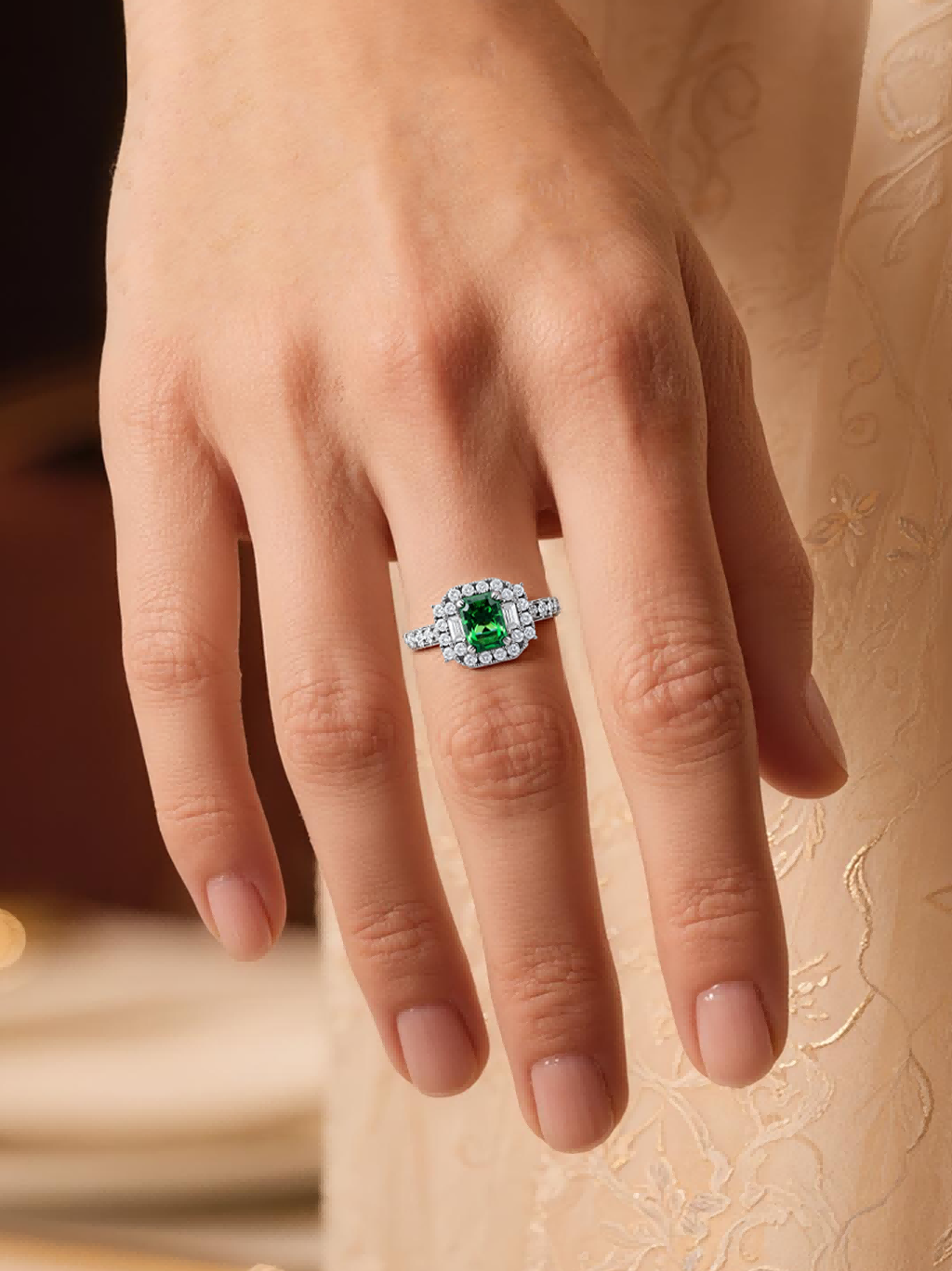 BuzzBloom customer wearing emerald halo ring with green gemstone in outdoor lifestyle side-profile scene, elegant art deco jewelry for women