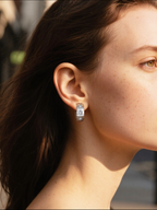 BuzzBloom customer wearing honeycomb design silver moissanite huggie earrings in outdoor lifestyle scene, unique geometric jewelry for stylish women