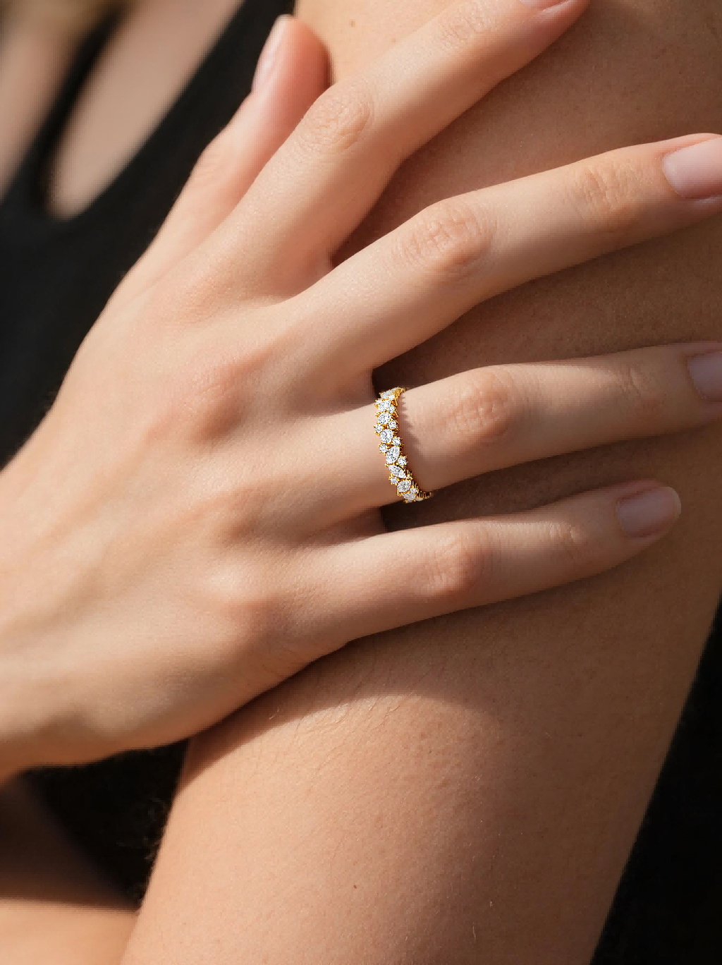 BuzzBloom customer wearing marquise and round moissanite eternity ring in gold, close-up jewelry shot for women