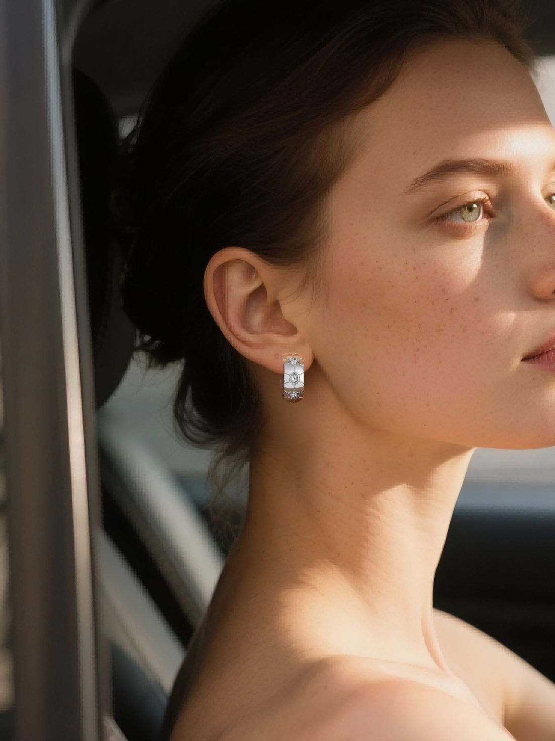 BuzzBloom customer wearing modern textured geometric silver hoop earrings in car lifestyle scene, BuzzBloom women’s luxury silver earrings