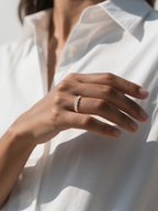 Customer wearing Bloomira prong set full circle diamond eternity ring, side profile shot in modern lifestyle scene