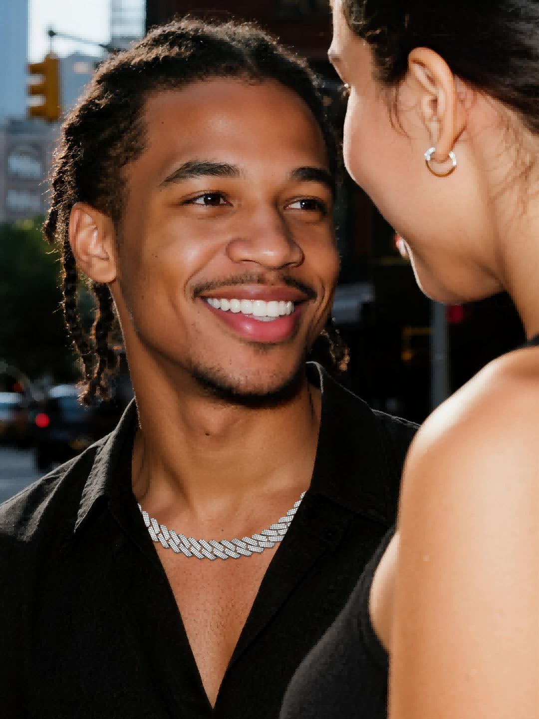 Customer wearing iced out Cuban chain at nightclub party, statement jewelry for men