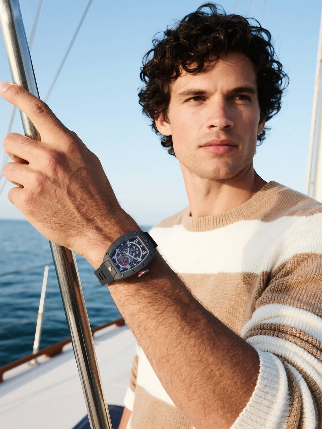 Customer wearing BuzzBloom 304 stainless steel sapphire men’s watch on yacht lifestyle scene, targeting men