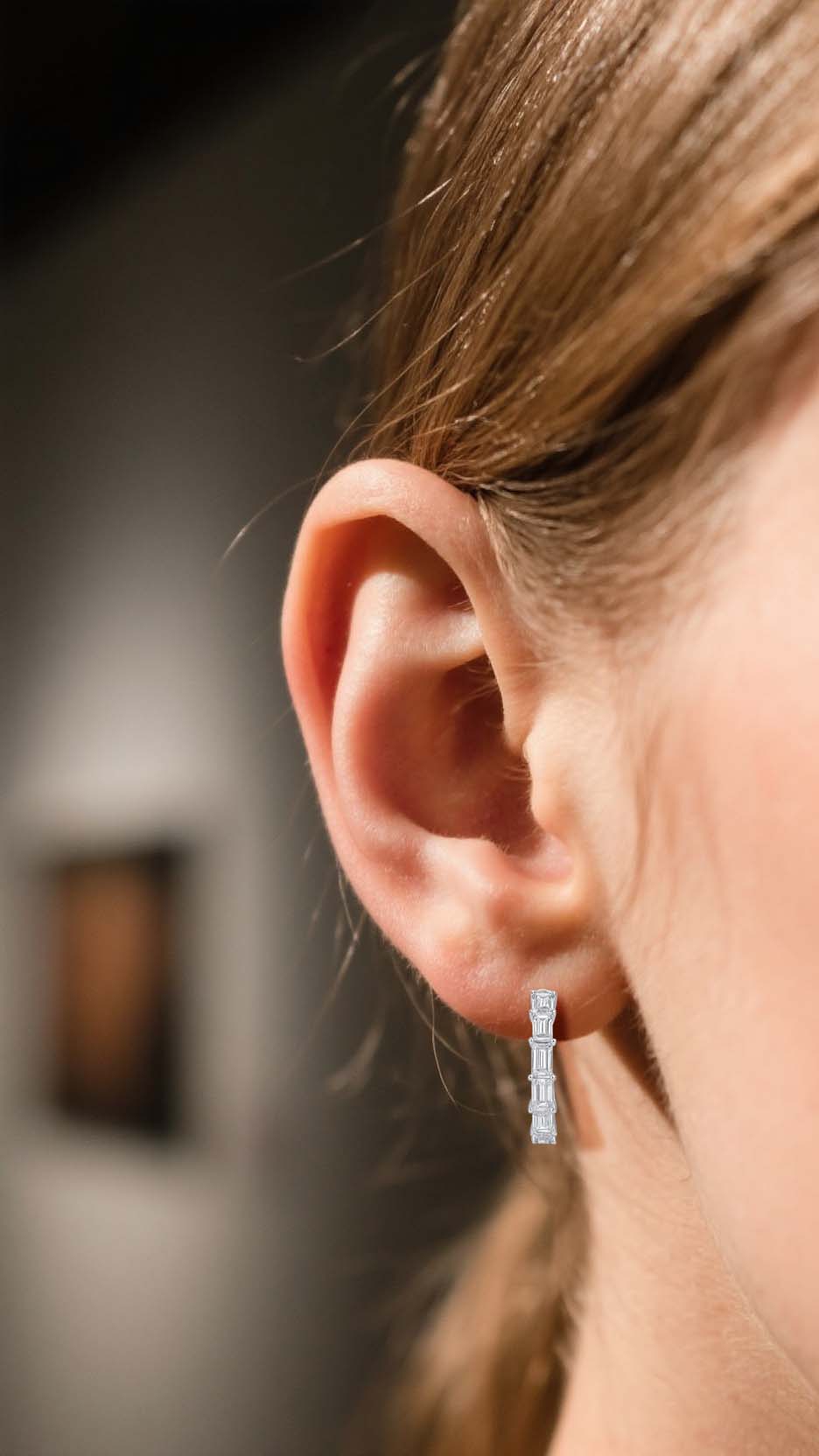 Customer wearing BuzzBloom silver hoop moissanite earrings with light reflection scene, elegant women jewelry