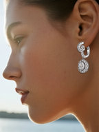 Customer wearing elegant diamond dangle earrings in outdoor daylight, stylish woman showcasing BUZZBLOOM fine jewelry