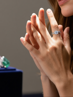 Customer wearing BuzzBloom white gold large round diamond ring in a showcase scene, stylish women