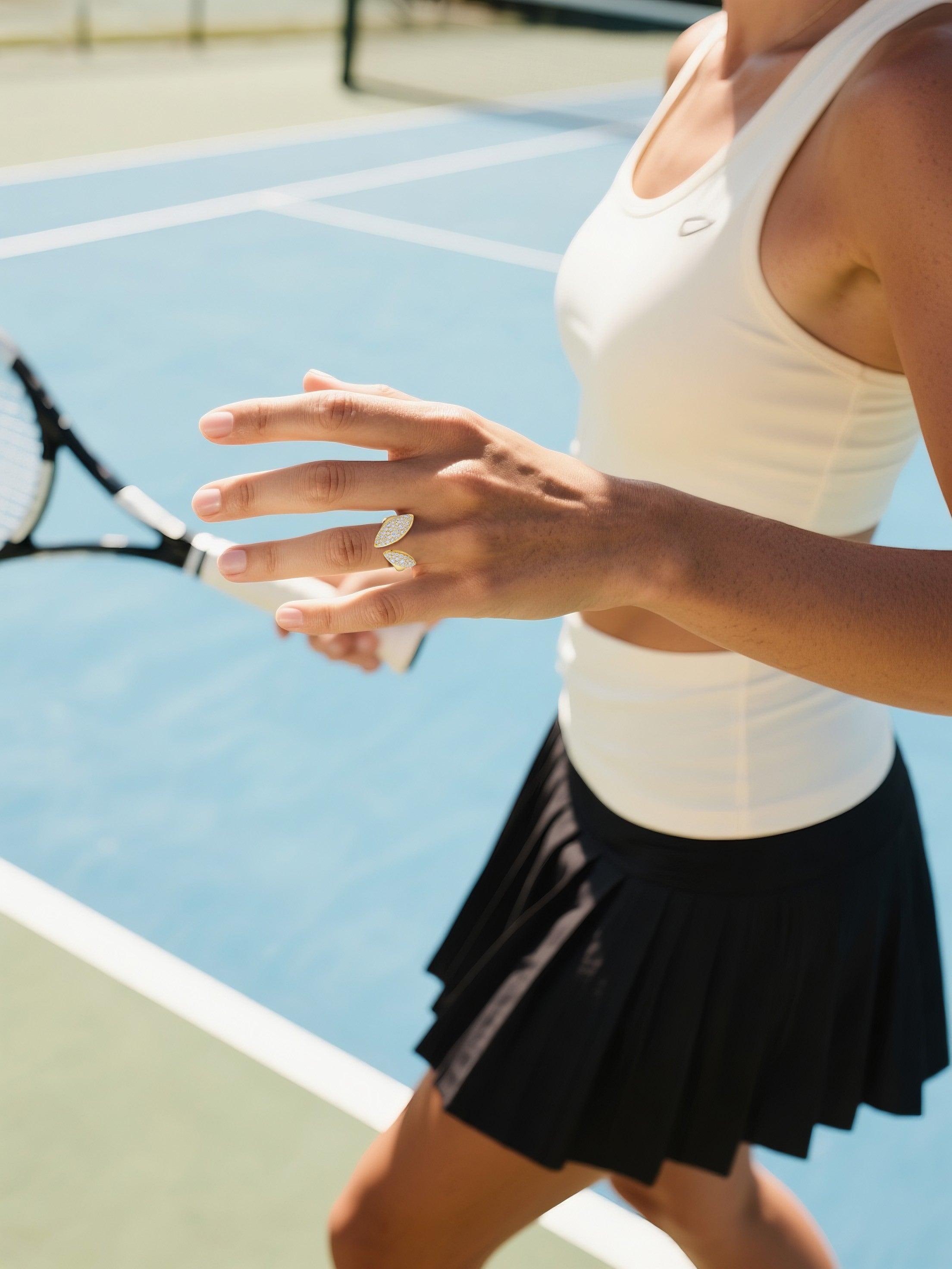 Customer showing dual flame gold ring with pavé diamonds while exercising outdoors, luxury sporty women’s jewelry