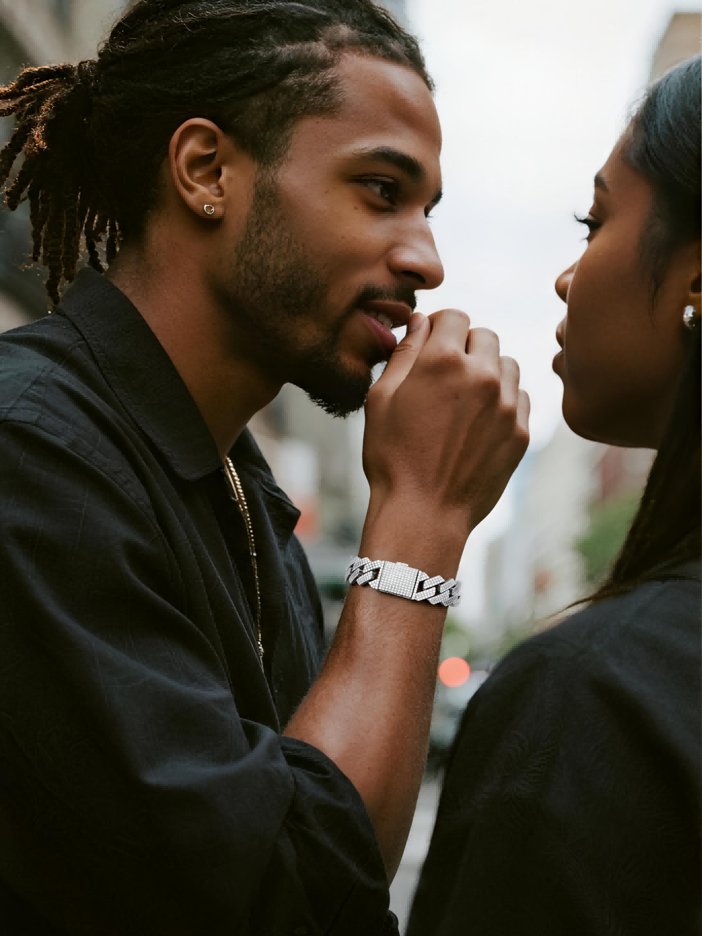 Customer showing luxury diamond pave Cuban bracelet in a nightlife scene, men’s fashion jewelry statement.