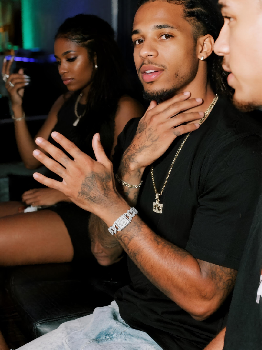 Customer wearing 14K thick Cuban link bracelet with diamonds in social setting, men’s Cuban jewelry.