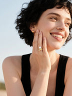 Model showcasing BuzzBloom designer pearl cocktail ring with Australian white shell pearl and diamond pavé in 14k gold, modern women’s fashion lifestyle