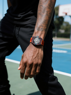 Customer wearing BuzzBloom stainless steel skeleton dial men’s watch with orange strap, outdoor streetwear look for men