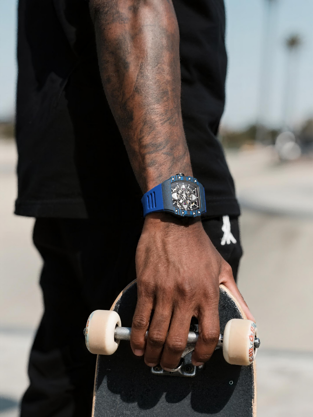 Customer wearing BuzzBloom luxury automatic watch with blue strap in casual street scene – young men’s fashion