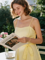 Customer wearing BuzzBloom colorful gemstone bracelet in a romantic couple garden scene, stylish women’s jewelry