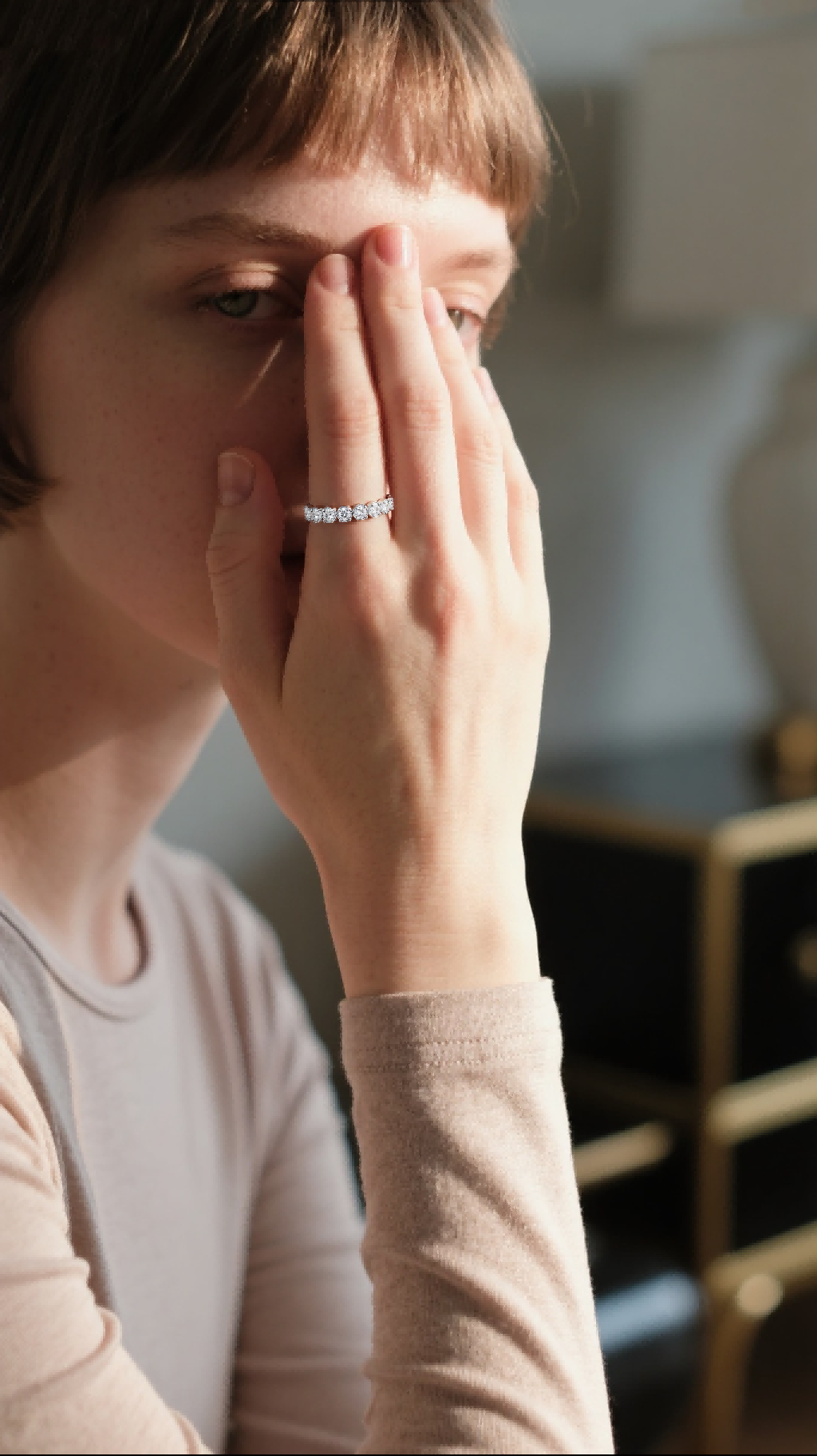 Customer wearing BuzzBloom white gold eternity ring in elegant scene, female audience