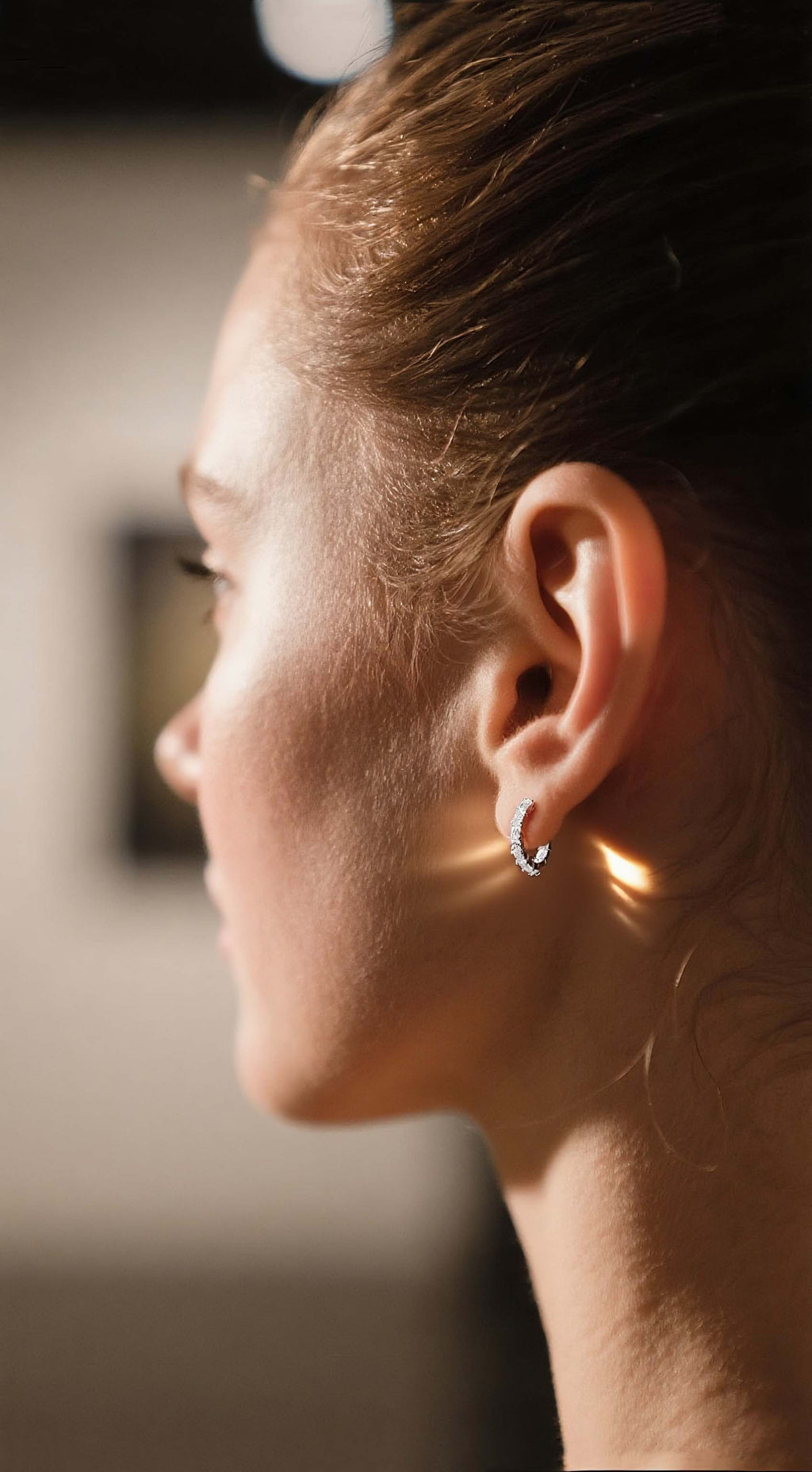 Customer wearing BuzzBloom baguette cut moissanite earrings close-up detail in exhibition, modern fashion women