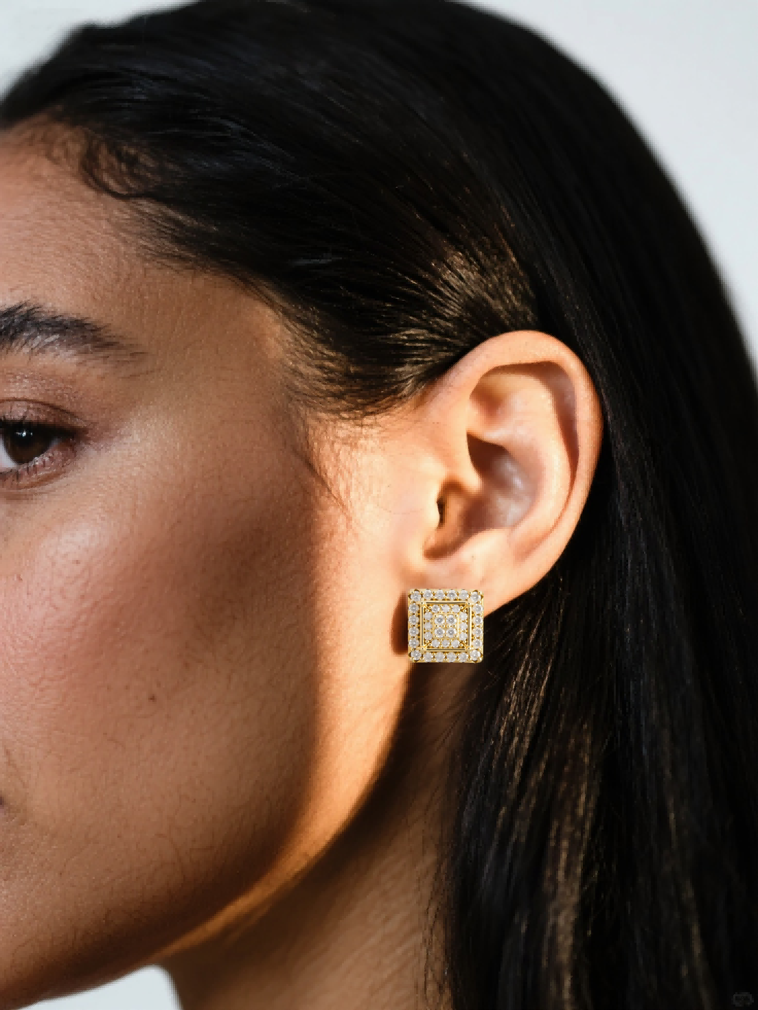 Customer wearing BuzzBloom geometric gold diamond stud earrings, lifestyle profile view, stylish fine jewelry for women