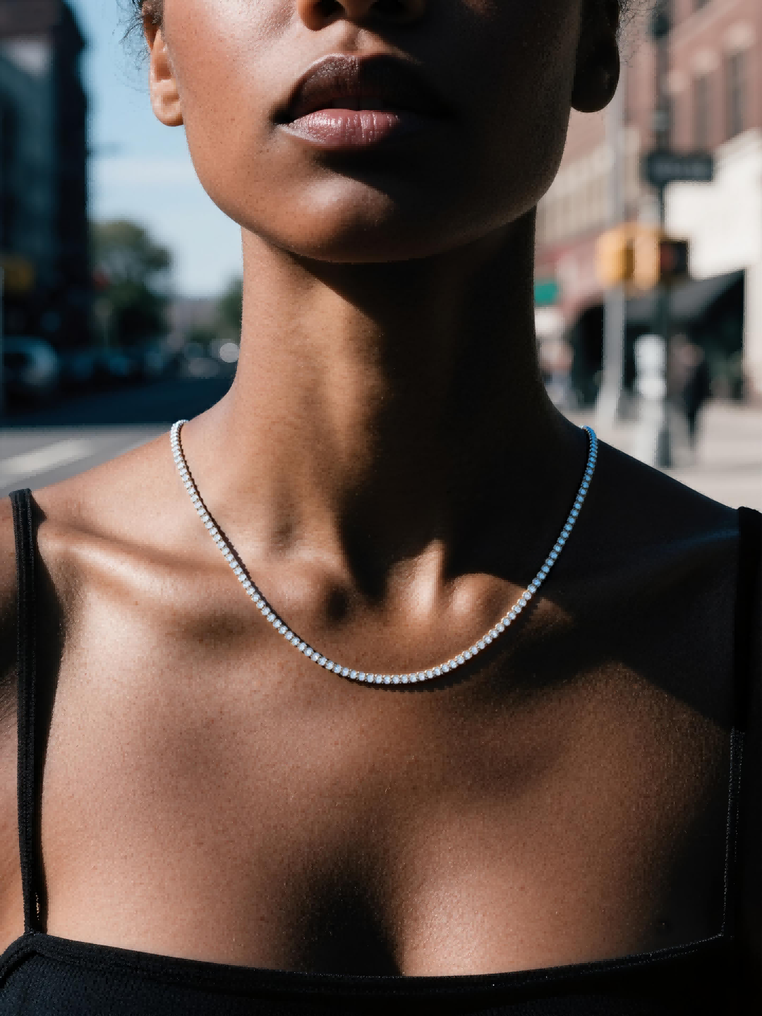 Customer wearing BuzzBloom minimalist tennis necklace close-up, women’s elegant jewelry