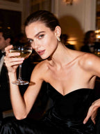 Model in evening dress with 14K gold diamond hoop earrings at Manhattan rooftop - BuzzBloom NYFW style