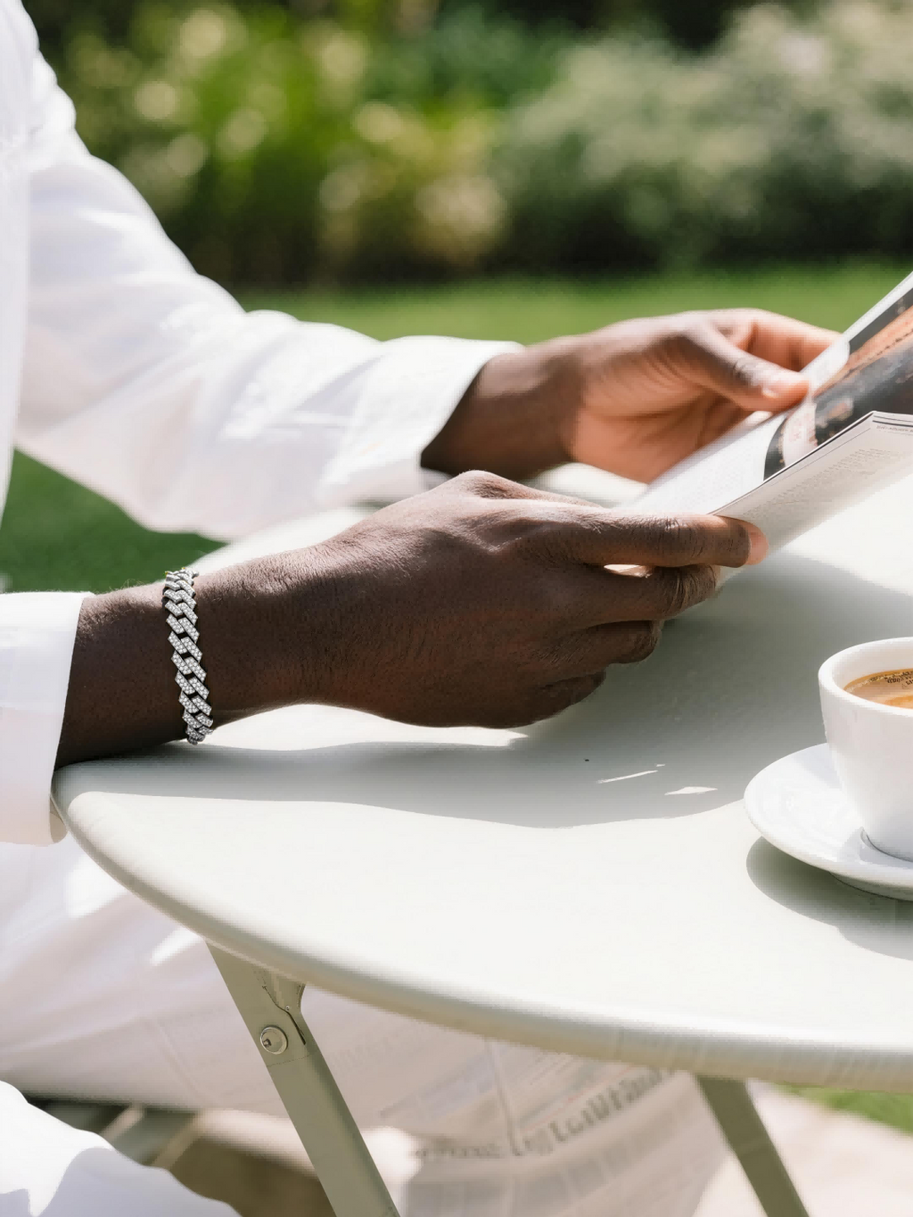 Own Your Bloom 14mm diamond 14K Cuban bracelet on man’s wrist outdoors, stylish men’s accessory for daily wear, Los Angeles.
