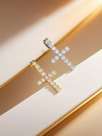Own Your Bloom 14K diamond cross pendant, lifestyle still life on golden rails with warm sunlight, Los Angeles.