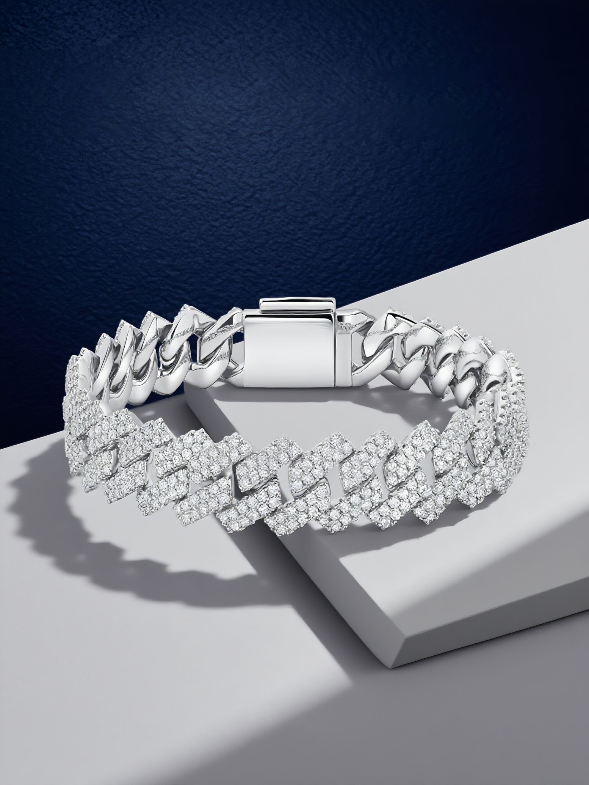 Own Your Bloom 14mm diamond Cuban bracelet displayed under soft lighting with reflection, luxury gift for men, Boston.