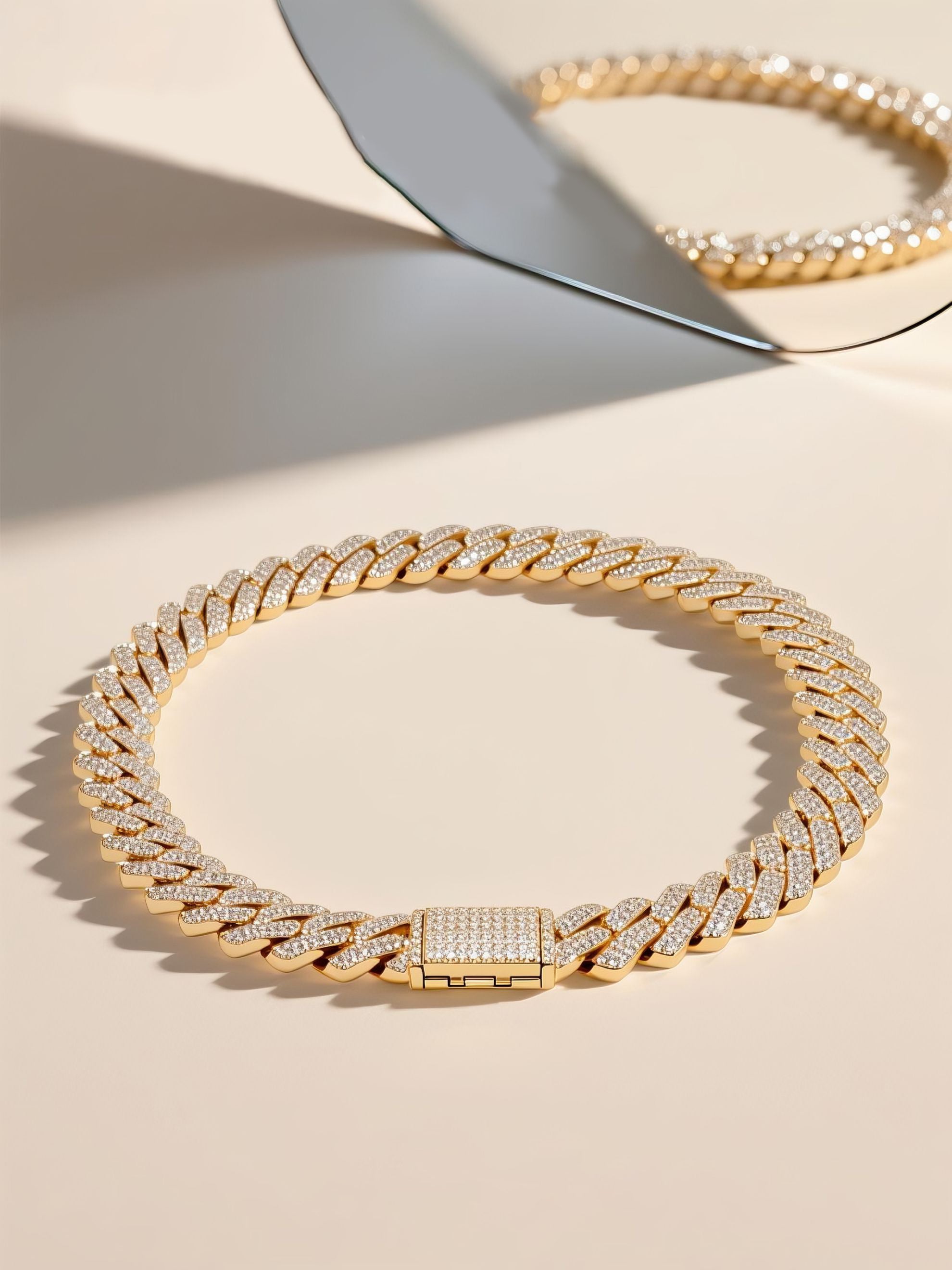 Own Your Bloom diamond Cuban chain on beige surface with mirrored luxury aesthetic, fine craftsmanship piece, Miami.