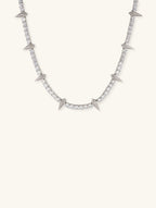 Own Your Bloom 14K diamond leopard claw tennis chain necklace in white gold, white background, New York USA