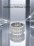 Own Your Bloom wide 14K diamond eternity ring on mirrored silver surface, luxury jewelry reflection photography, San Diego.