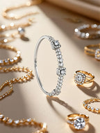 Own Your Bloom 14K diamond tennis bracelet displayed on beige surface with luxury jewelry background, Miami.