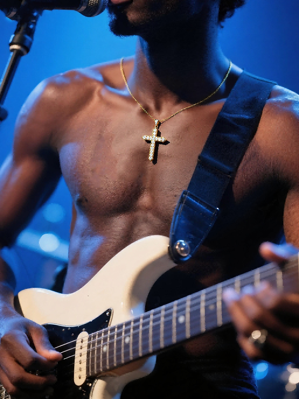 Male vocalist on stage wearing Own Your Bloom diamond cross necklace at a Seattle concert.