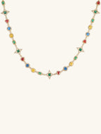 Own Your Bloom 14K gold multicolor diamond necklace front view featuring vibrant gemstones in red, green, blue, and yellow, New York.