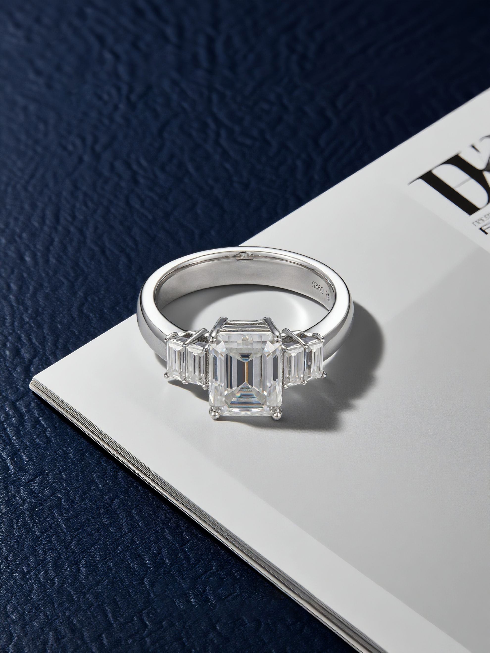 Own Your Bloom 14K large square diamond ring placed on magazine page, luxury jewelry editorial photography, Miami.