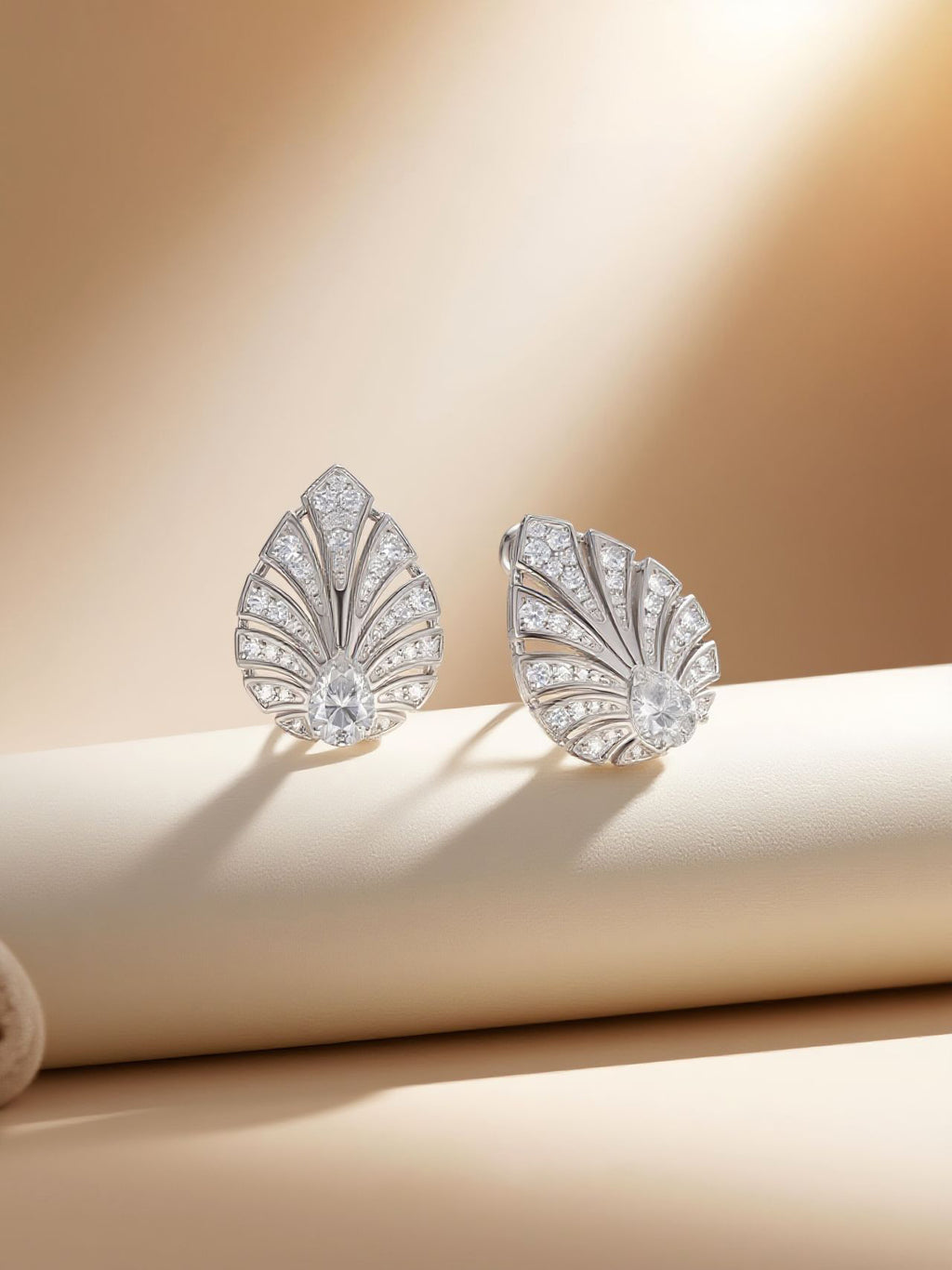 own your bloom 14K white gold pavé diamond earrings displayed on pedestal edge, studio lifestyle, Miami FL