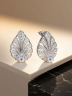 own your bloom pavé-set diamond earrings on soft satin roll, lifestyle composition, Dallas TX
