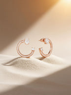 Own Your Bloom 14K rose gold diamond fashion earrings in studio spotlight, lifestyle setup, Miami.
