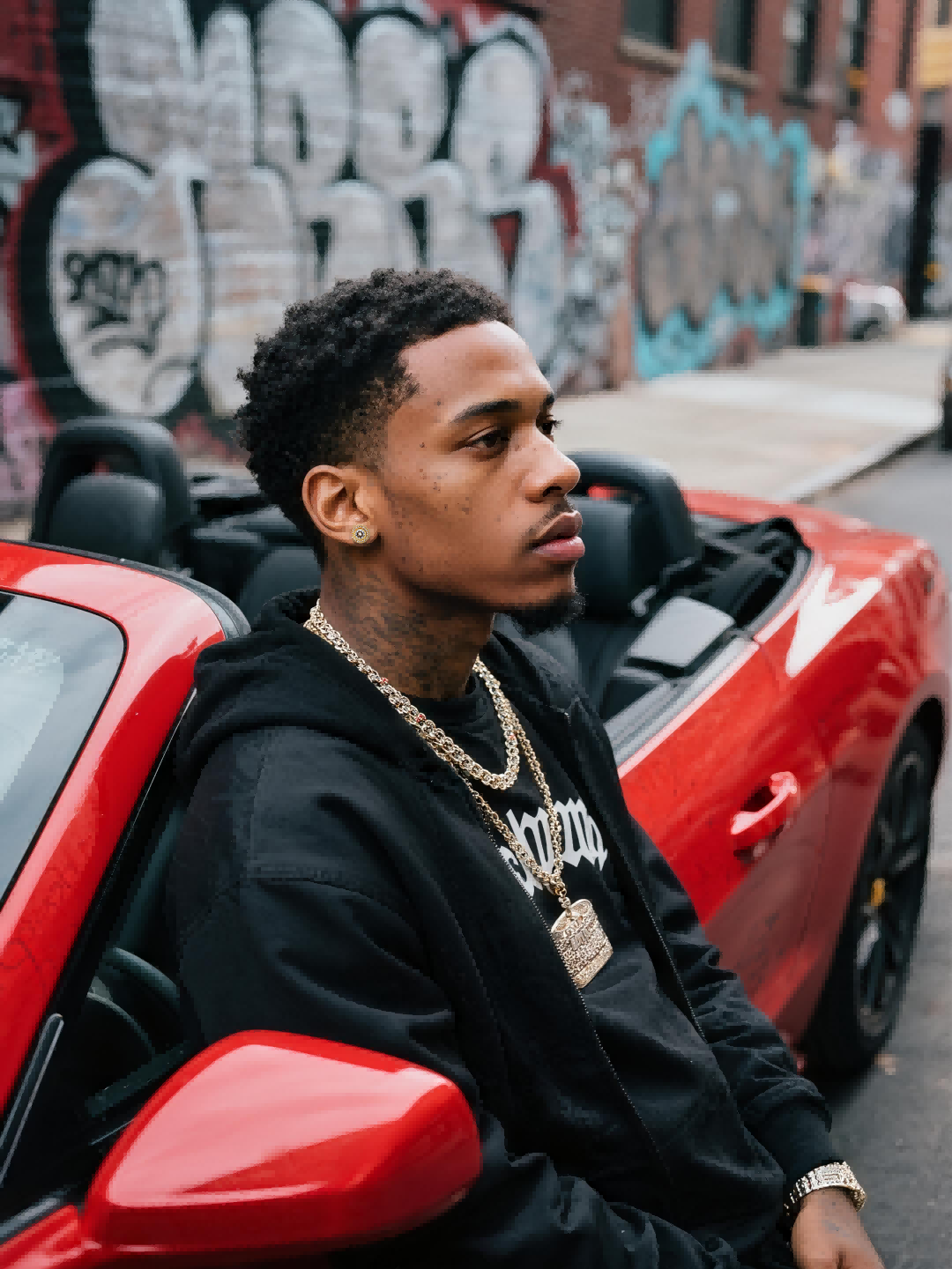 Pair of Own Your Bloom round full-gold diamond studs on beige surface with soft shadows, minimal lifestyle shot, New York boutique feel.