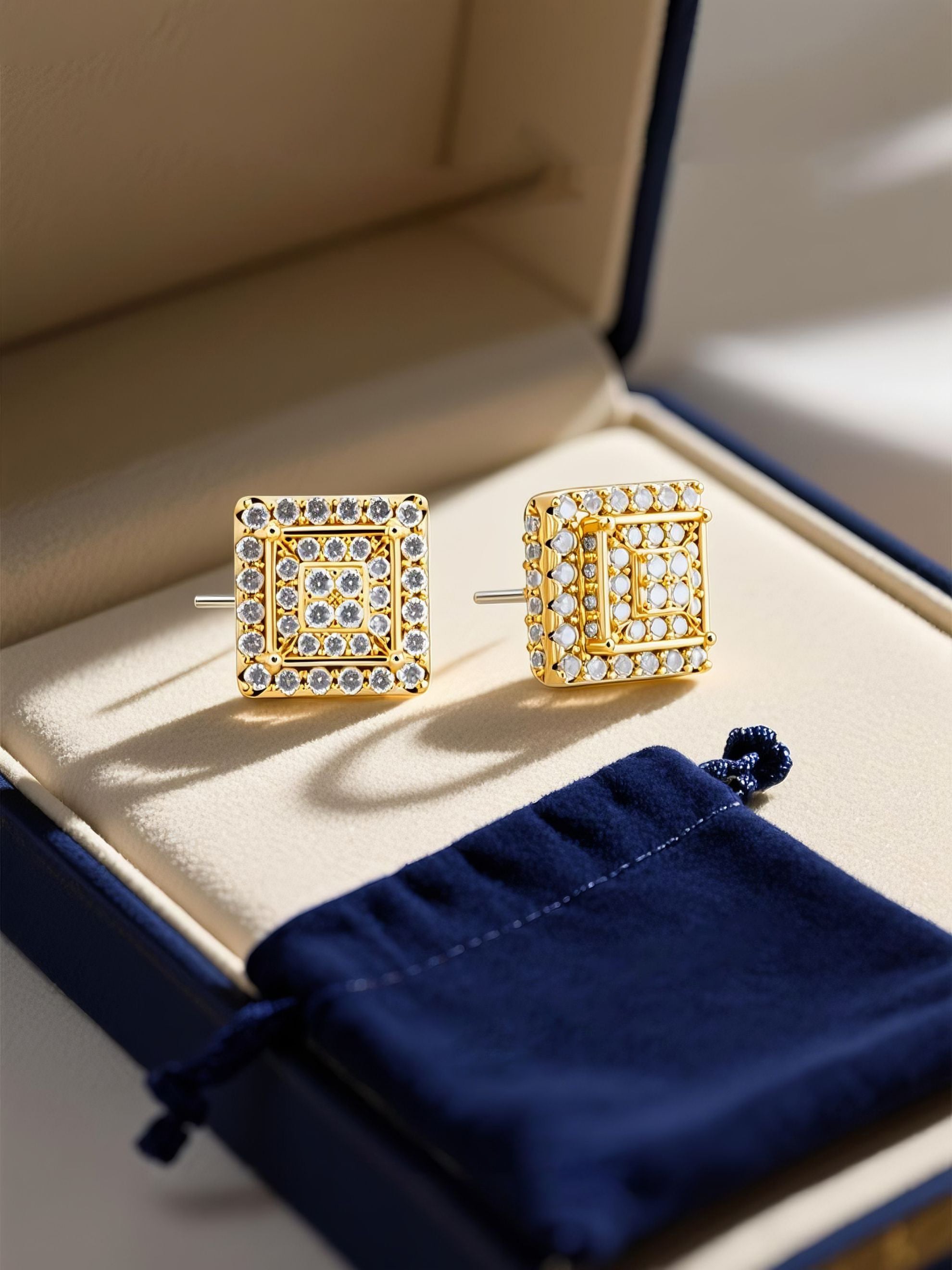 Own Your Bloom 14K gold square diamond flower stud earrings photographed on silk fabric with gift pouch, Miami.