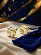 Own Your Bloom 14K gold diamond square stud earrings with intricate floral setting under elegant lighting, Seattle.