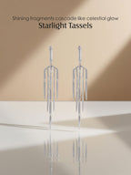 Own Your Bloom 14K tassel line diamond earrings displayed on mirrored surface with soft natural lighting, luxury fine jewelry, Miami.
