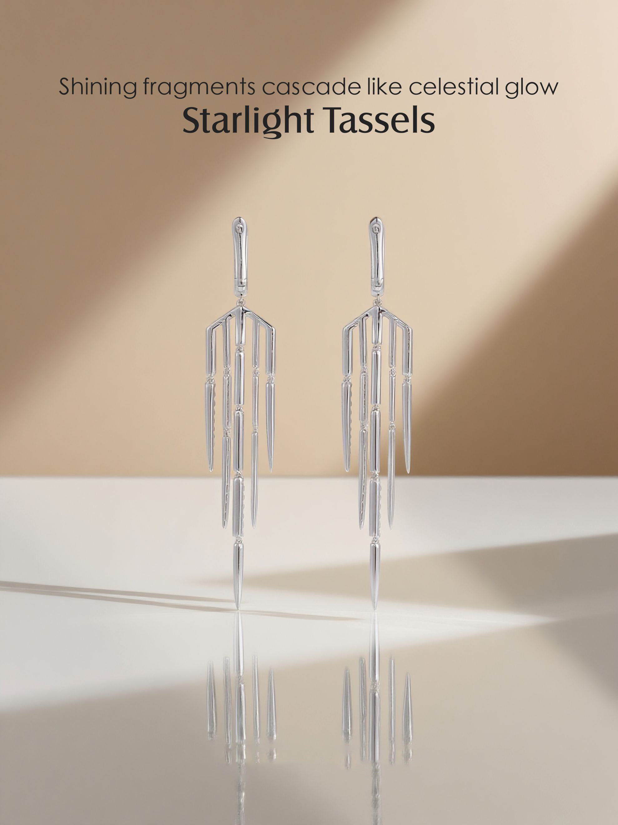 Own Your Bloom 14K tassel line diamond earrings displayed on mirrored surface with soft natural lighting, luxury fine jewelry, Miami.