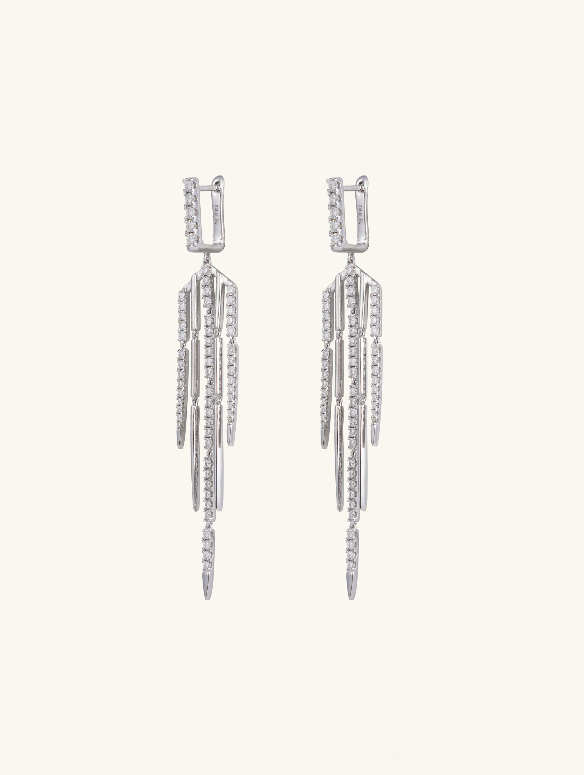 Own Your Bloom 14K tassel line diamond earrings front view in white gold with cascading baguette and round diamonds, fine jewelry, New York.