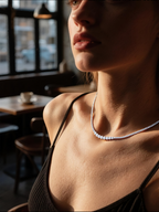 Own Your Bloom 14K moissanite tennis necklace worn by woman in urban sunlight, classic fine jewelry sophistication, New York.