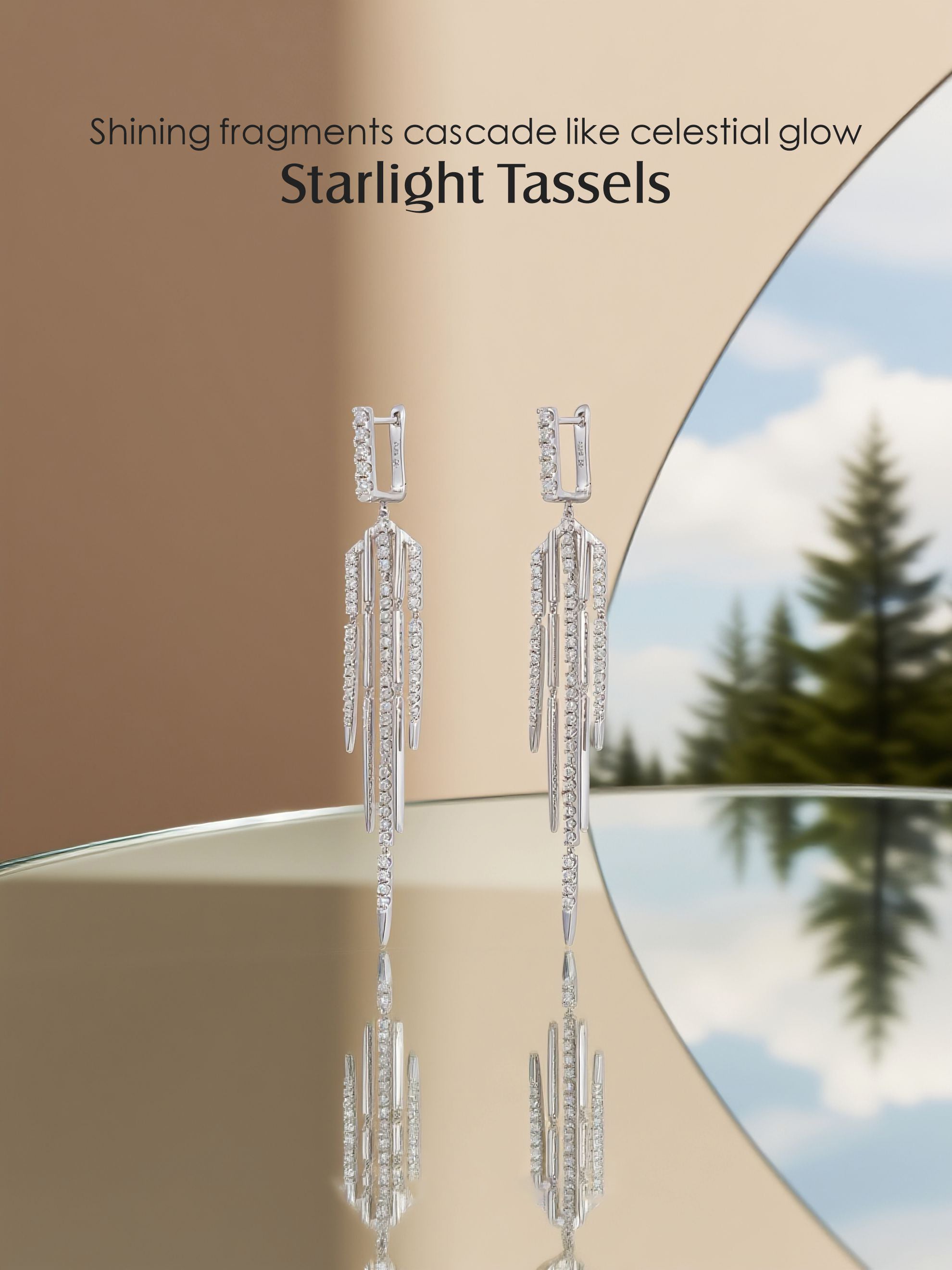 Own Your Bloom 14K tassel line diamond earrings displayed with reflection on mirror, celestial-inspired fine jewelry, Boston.