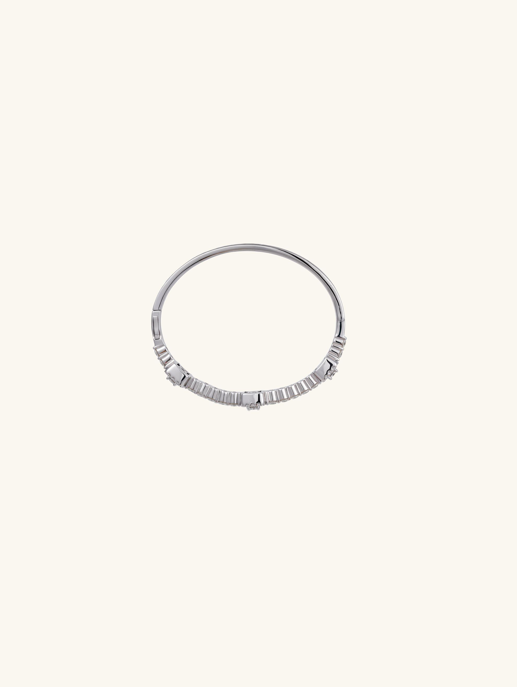 Own Your Bloom 14K white gold diamond tennis bracelet side angle highlighting baguette and round diamonds, Los Angeles.