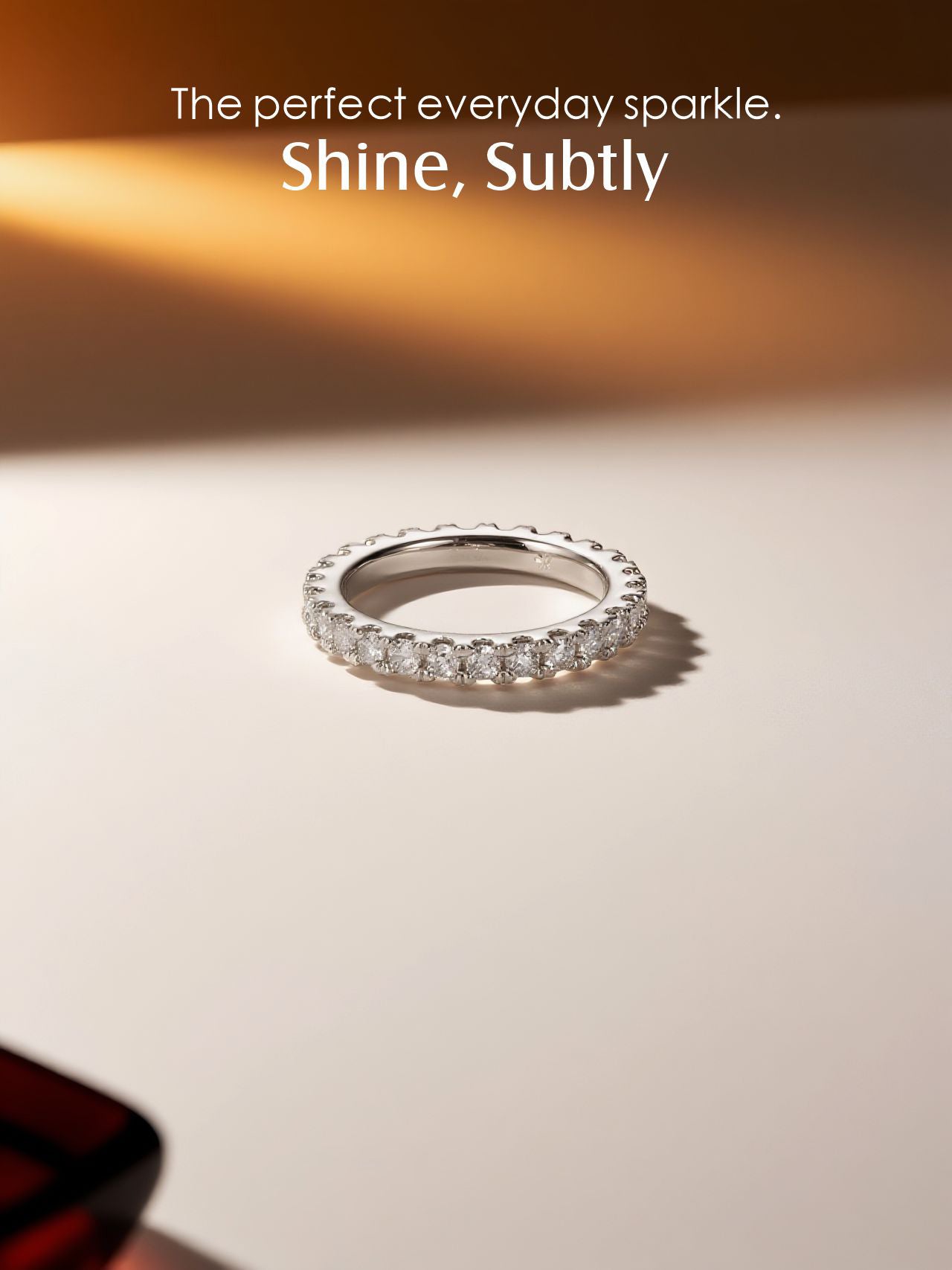 Own Your Bloom 14K white gold slim pavé diamond band, lifestyle still life on clean studio backdrop, San Francisco.