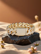 Own Your Bloom 14K diamond Cuban bracelet displayed on sand and rock, symbol of Miami luxury streetwear culture.